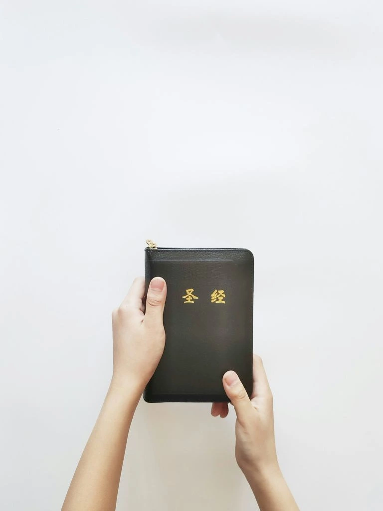 A cloth-bound travel handbook resting on a wooden desk
